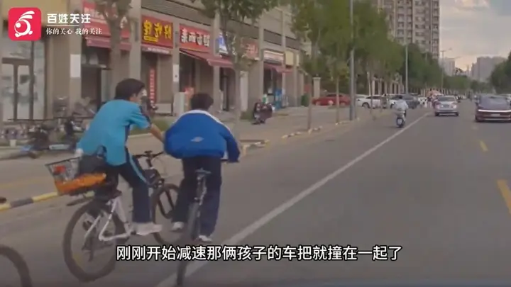 山西两学生骑车打闹摔倒,险遭后车碰撞,“我在车上害怕,他还向同学表示不危险”