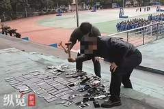 一场精心策划的“表演式执法”!学校将没收来的上百部学生手机当众砸毁